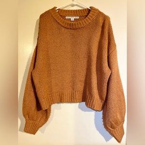 Peach, thick knit sweater, with long balloon sleeves. Size S. Brand is HYFVE